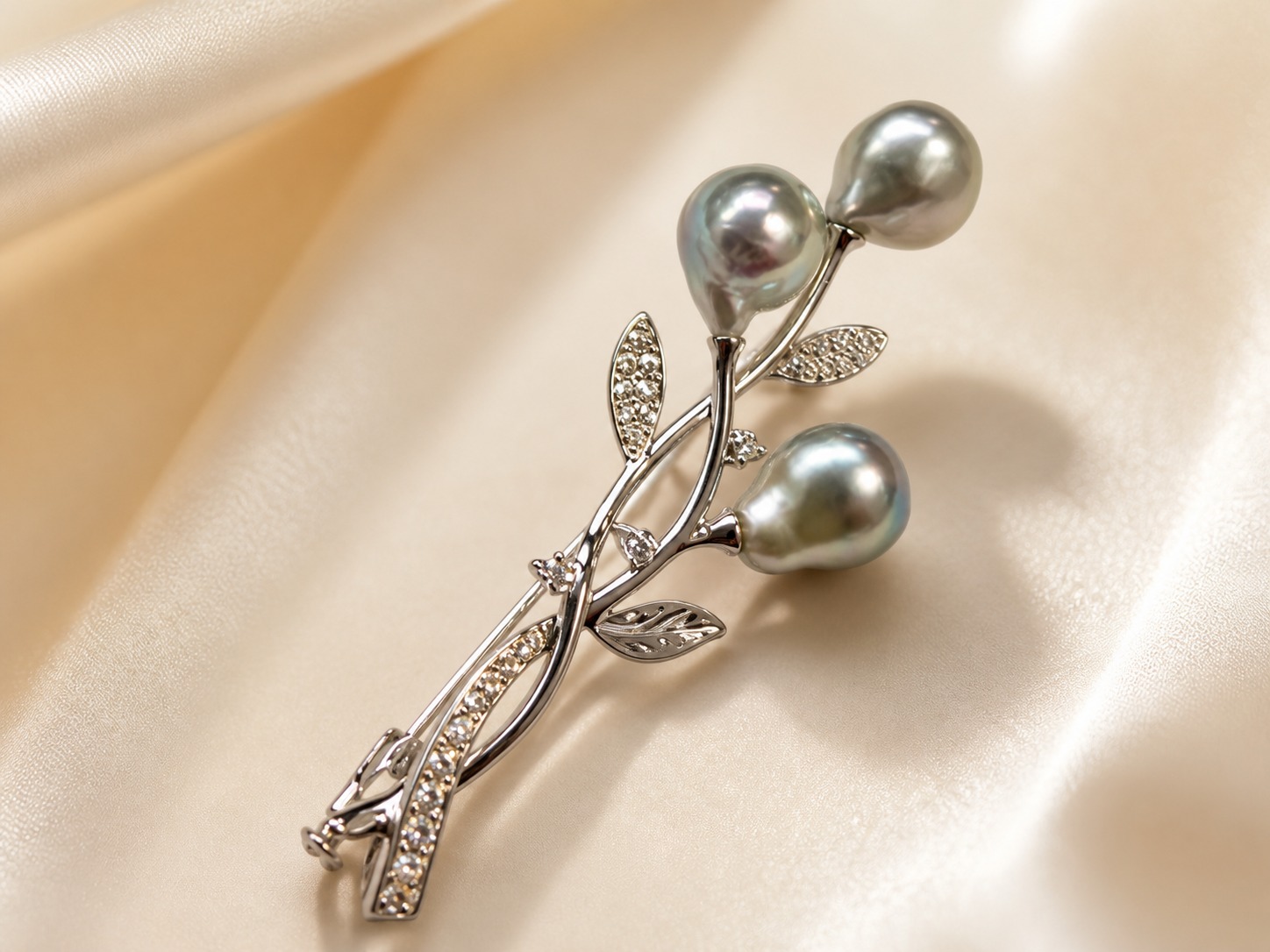 Gray baroque Akoya pearl brooch on satin