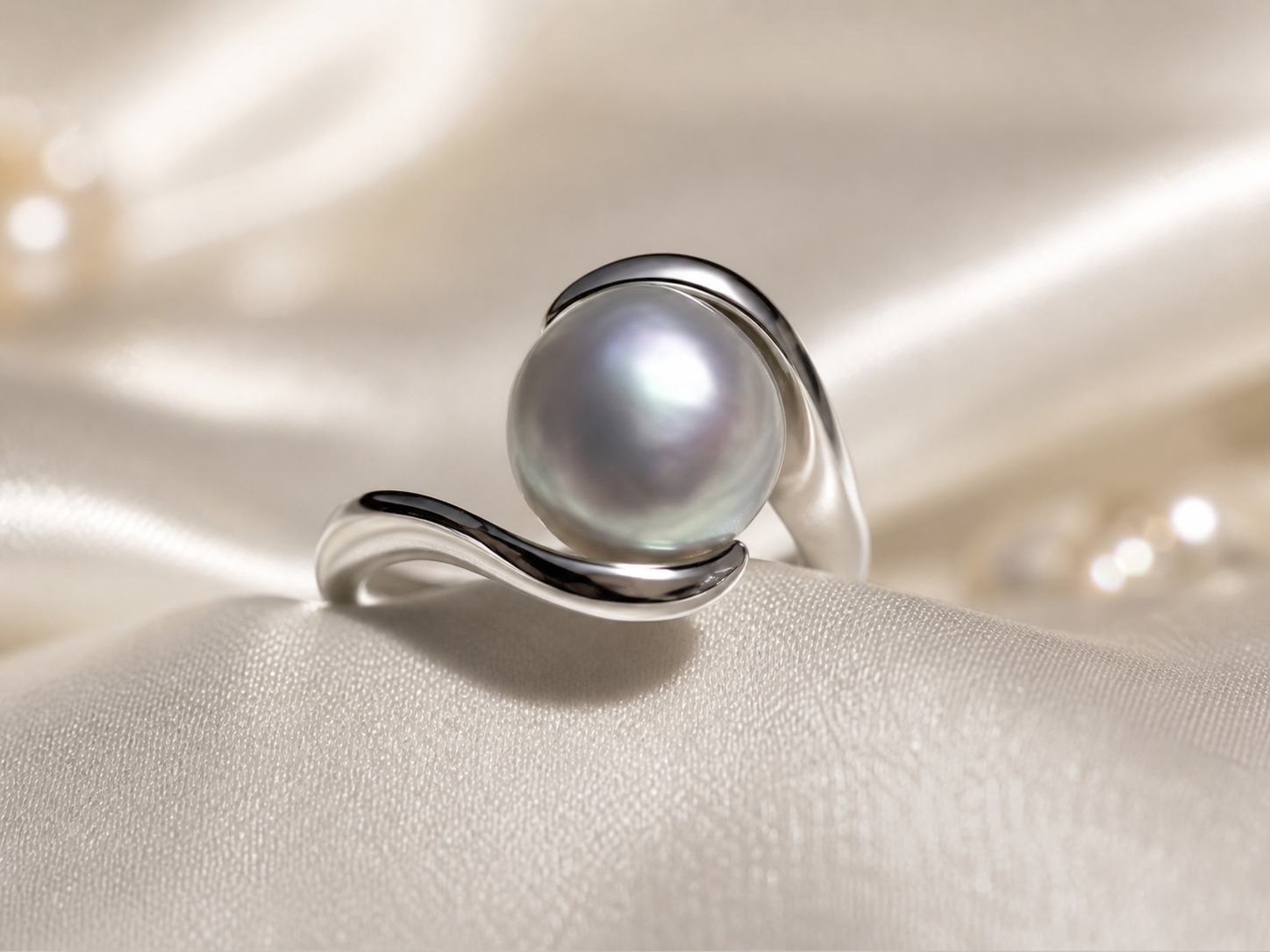 Gray baroque Akoya pearl ring on satin
