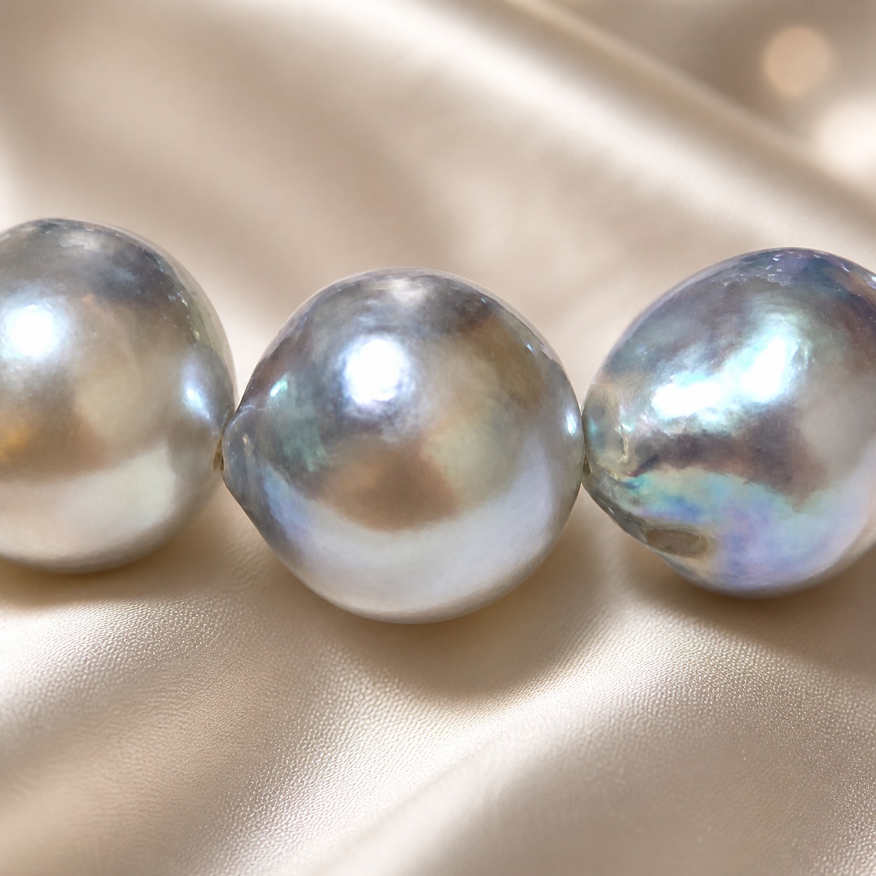 Gray baroque Akoya pearls showing blue, silver, and lavender interference colors